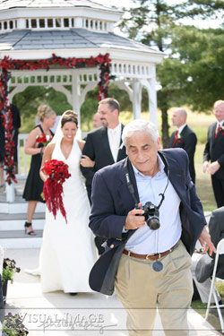 wedding guest in professional photographer's way